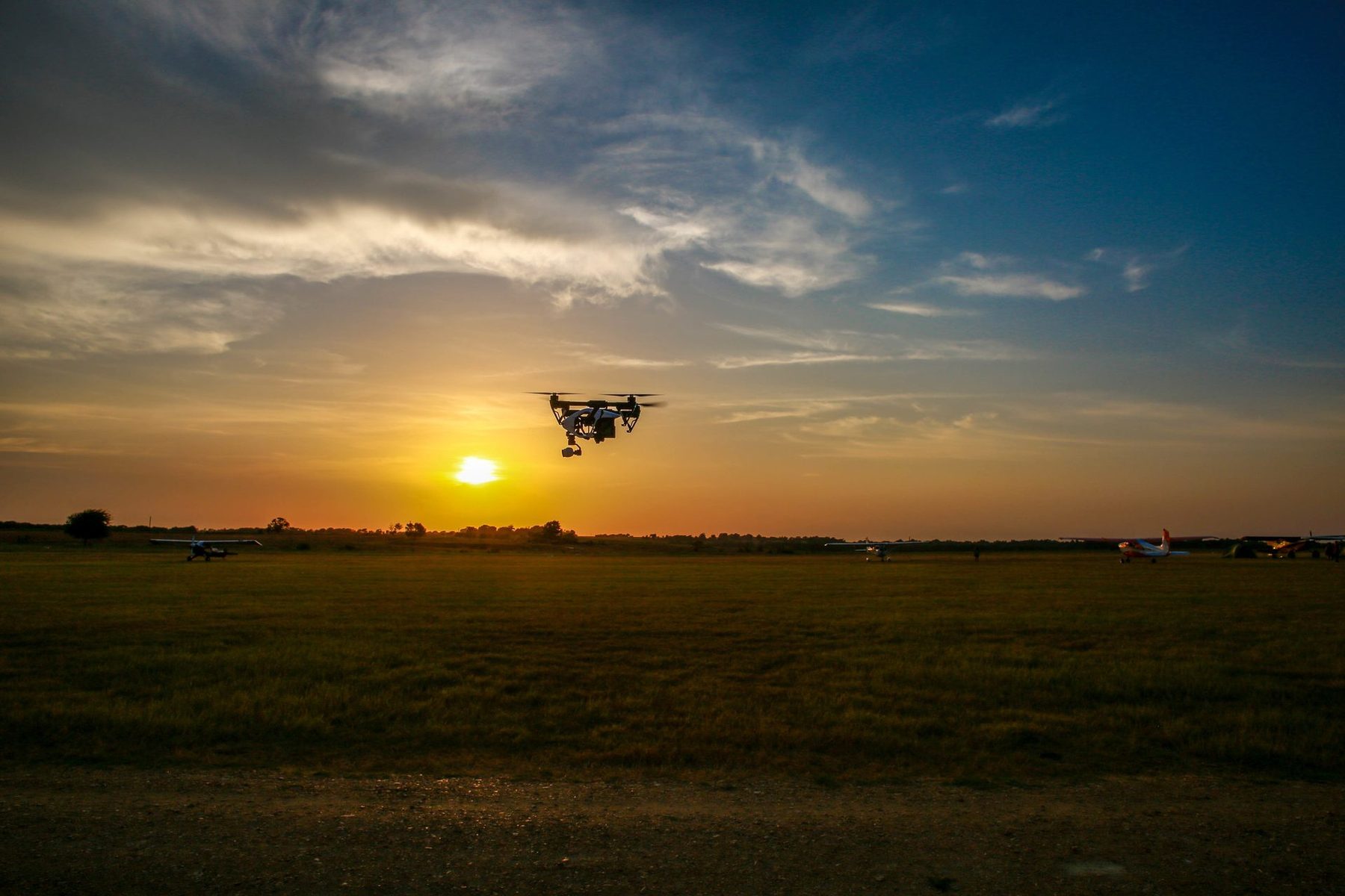 Aerialcam Media drone in flight at sunset over the Texas plains